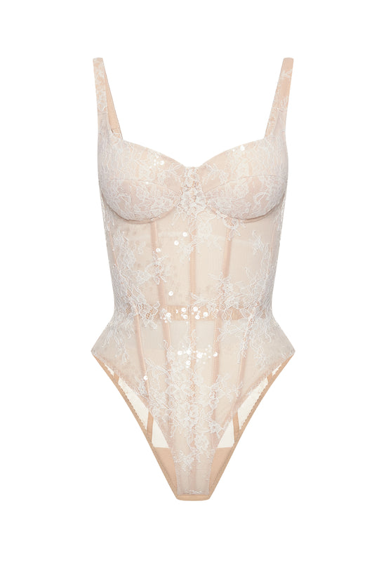 Desire drop. White lace bodysuit on a beige base
