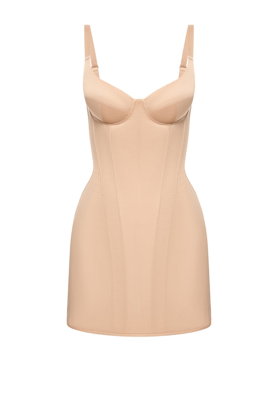 Defiance drop. A beige dress with fixed straps