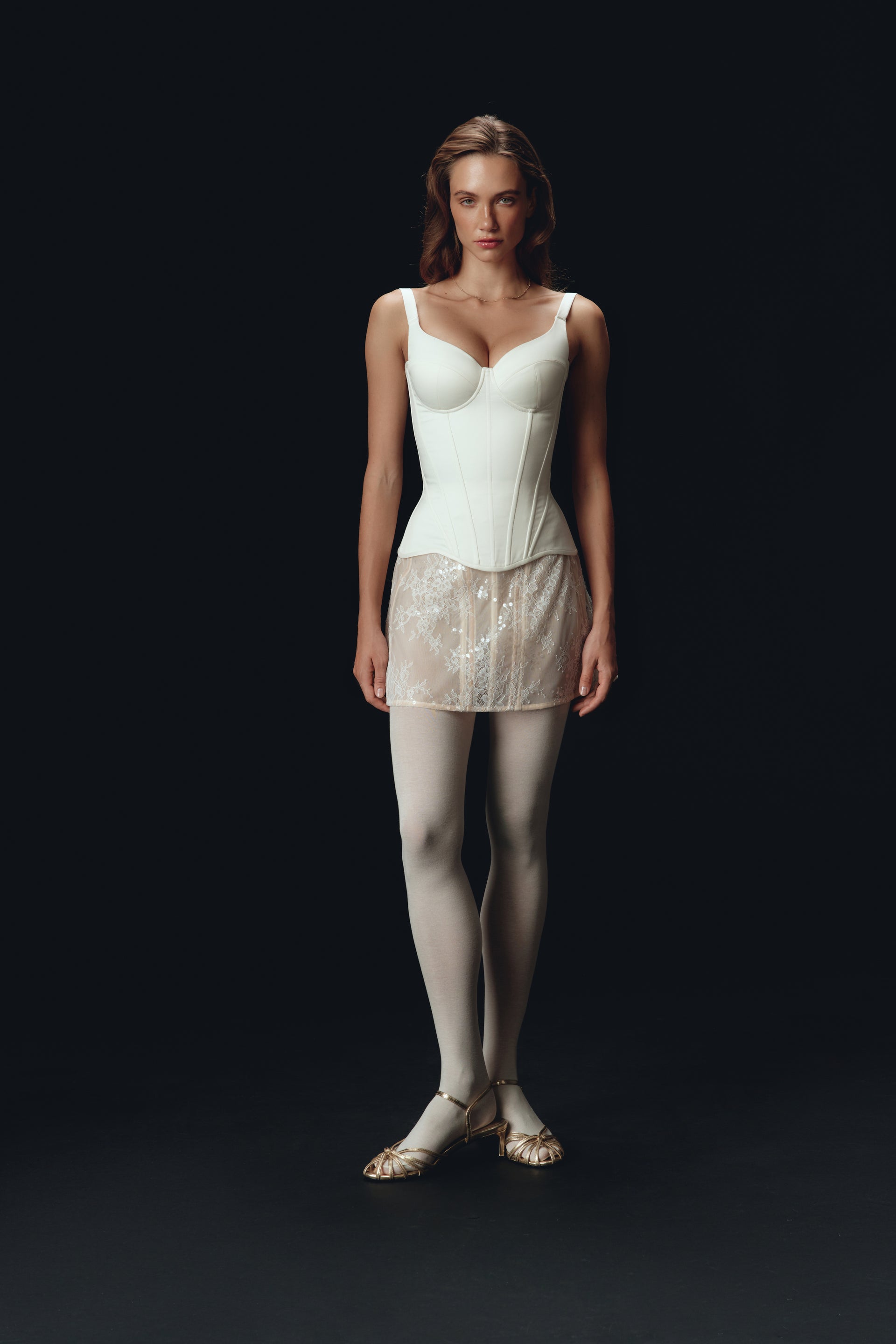 Defiance drop. An off-white corset with fixed straps
