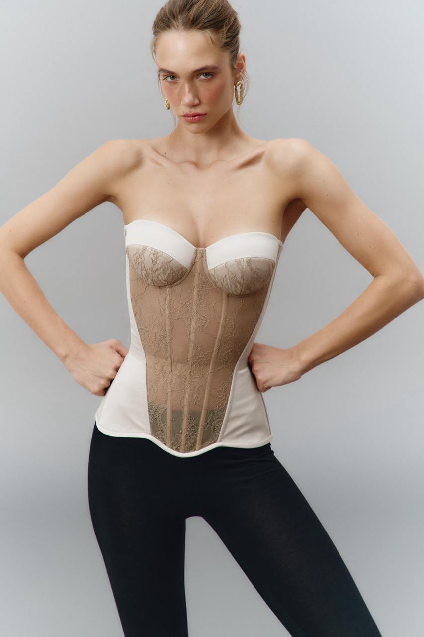 Defiance drop. A beige corset with a lace front